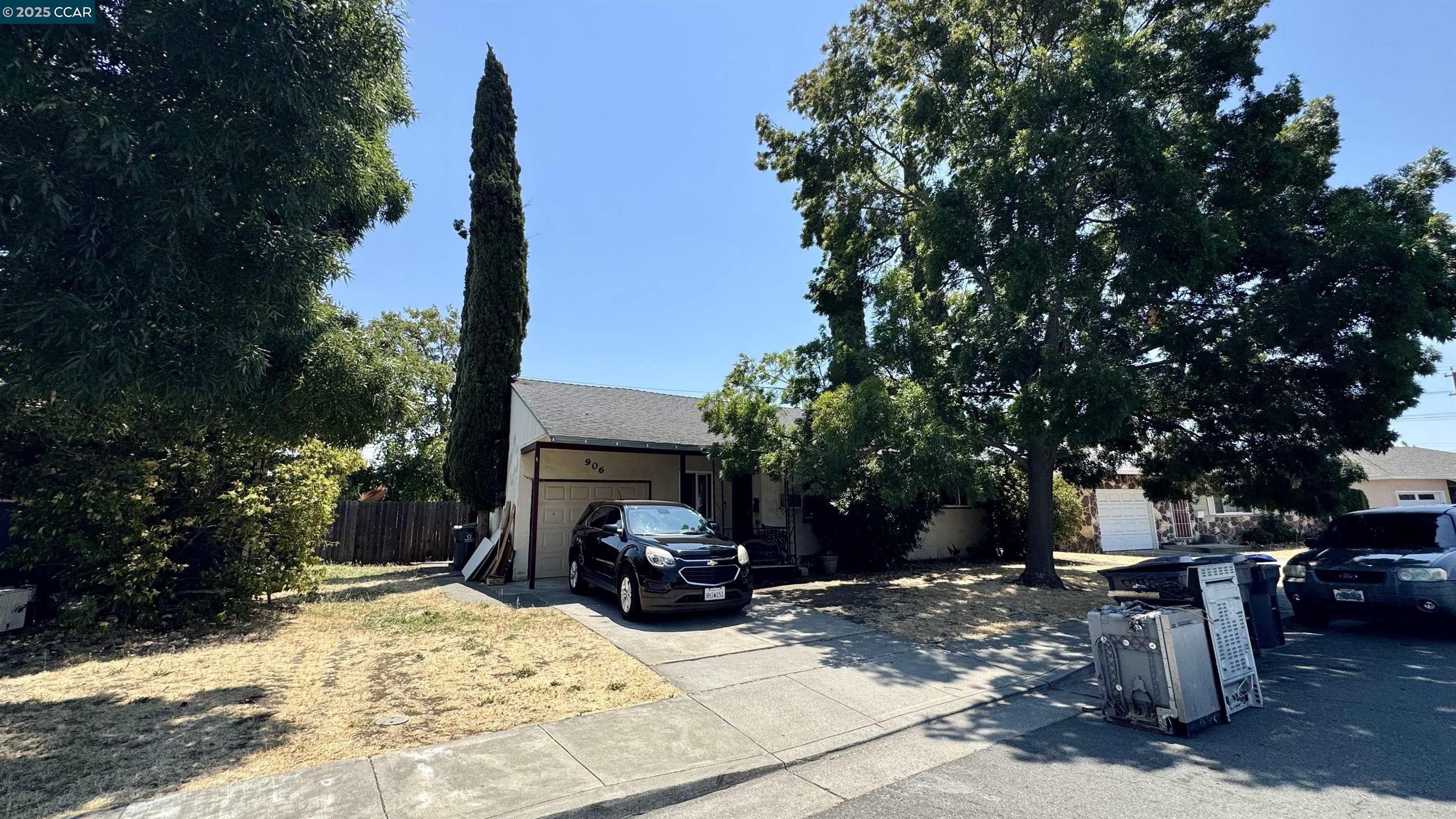 a view of a backyard with sitting area