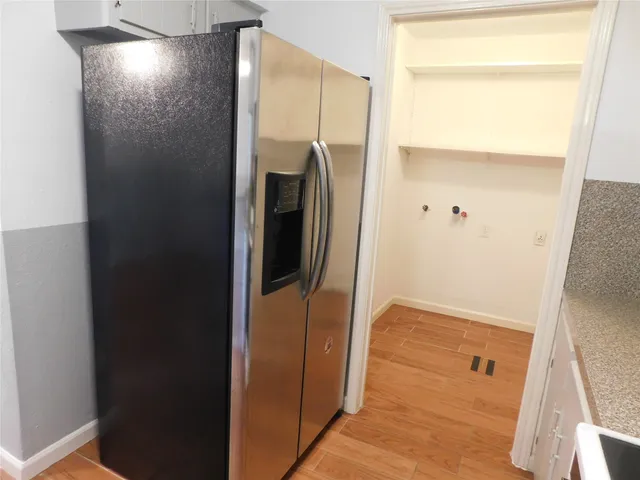 a bathroom with a glass door shower and a mirror