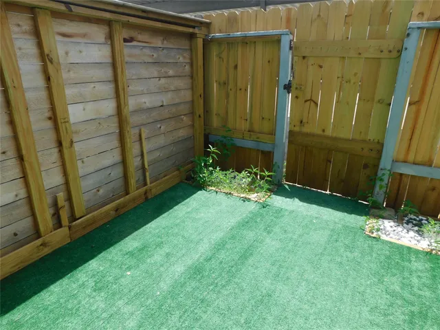 a view of a back yard from a room