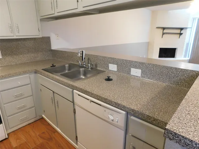 a kitchen with appliances and cabinets