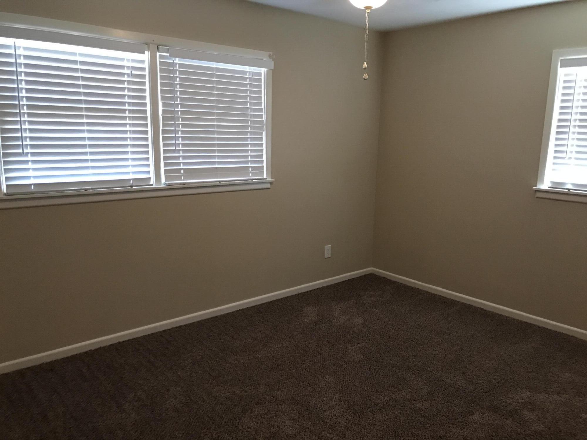 4409 27th Street Lubbock, TX 79410 - Photo 13 of 18 an empty room with a window
