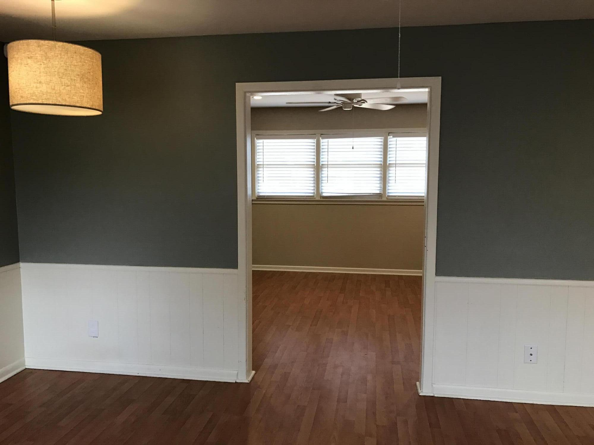 4409 27th Street Lubbock, TX 79410 - Photo 14 of 18 a view of an empty room with wooden floor and a window