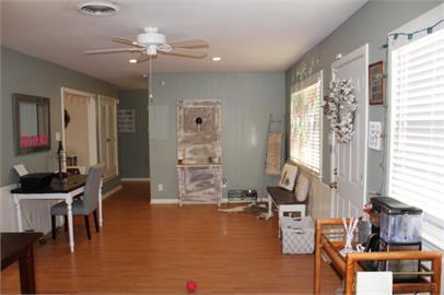 4409 27th Street Lubbock, TX 79410 - Photo 5 of 18 a living room with fireplace furniture and a window