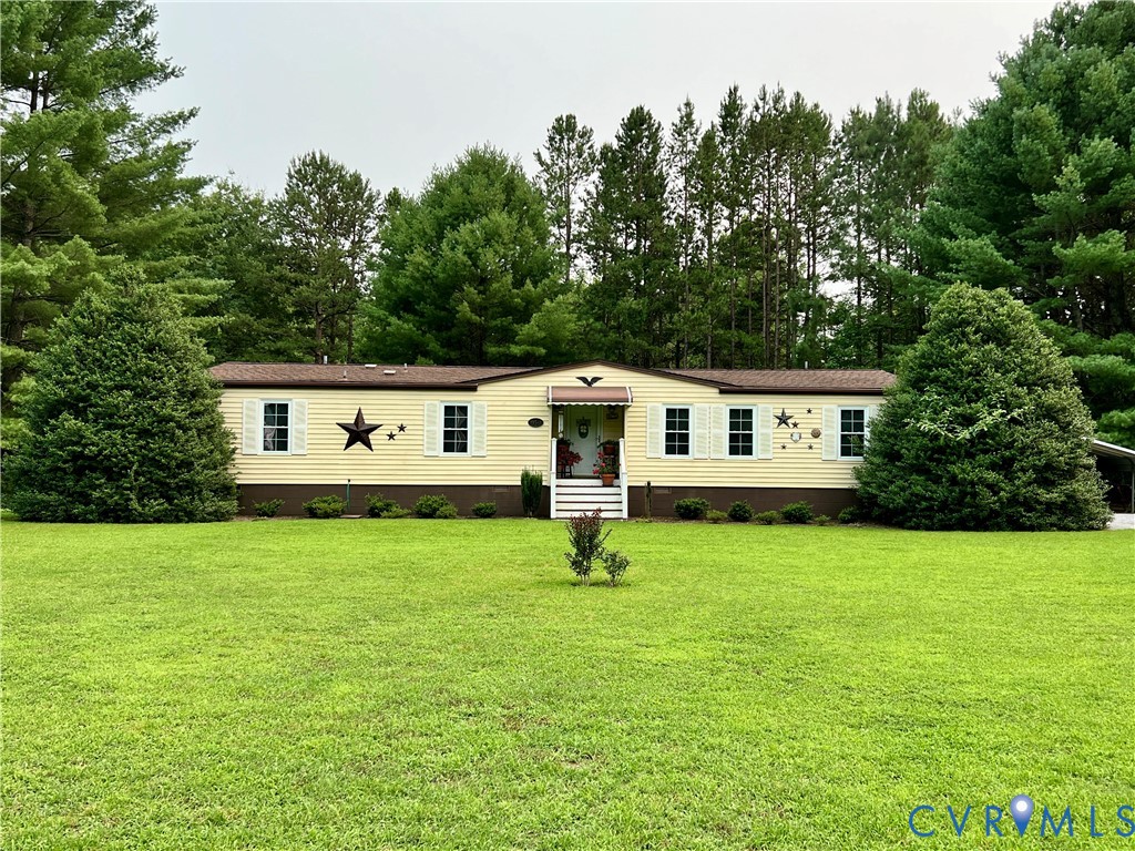 19541 Templeton Road Carson, VA 23830 - Photo 1 of 2 Expansive lawn with mature landscaping framing a s