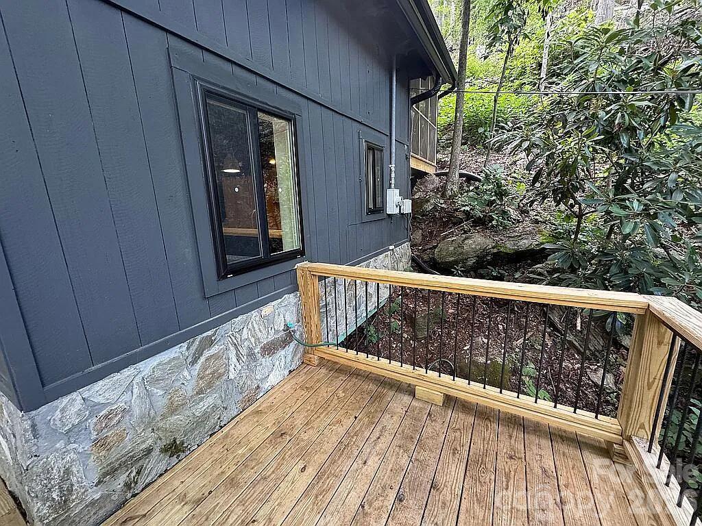 101 Mountain Farm Road Burnsville, NC 28714 - Photo 11 of 32 a view of balcony with wooden floor