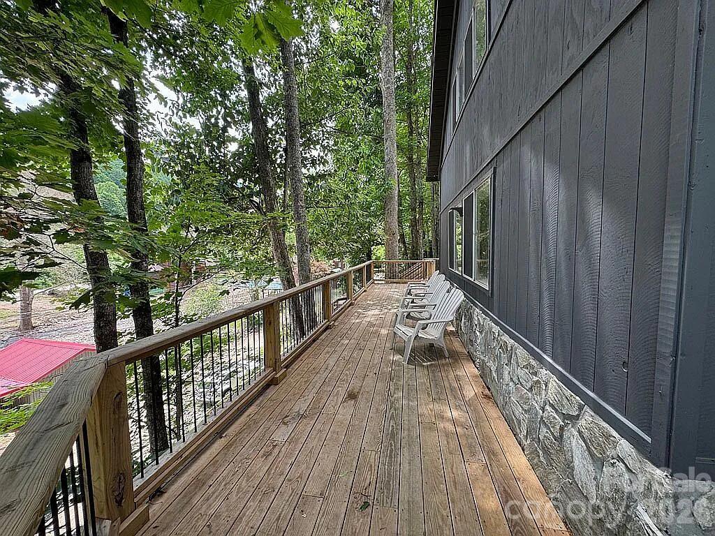 101 Mountain Farm Road Burnsville, NC 28714 - Photo 14 of 32 a view of balcony with wooden floor and fence