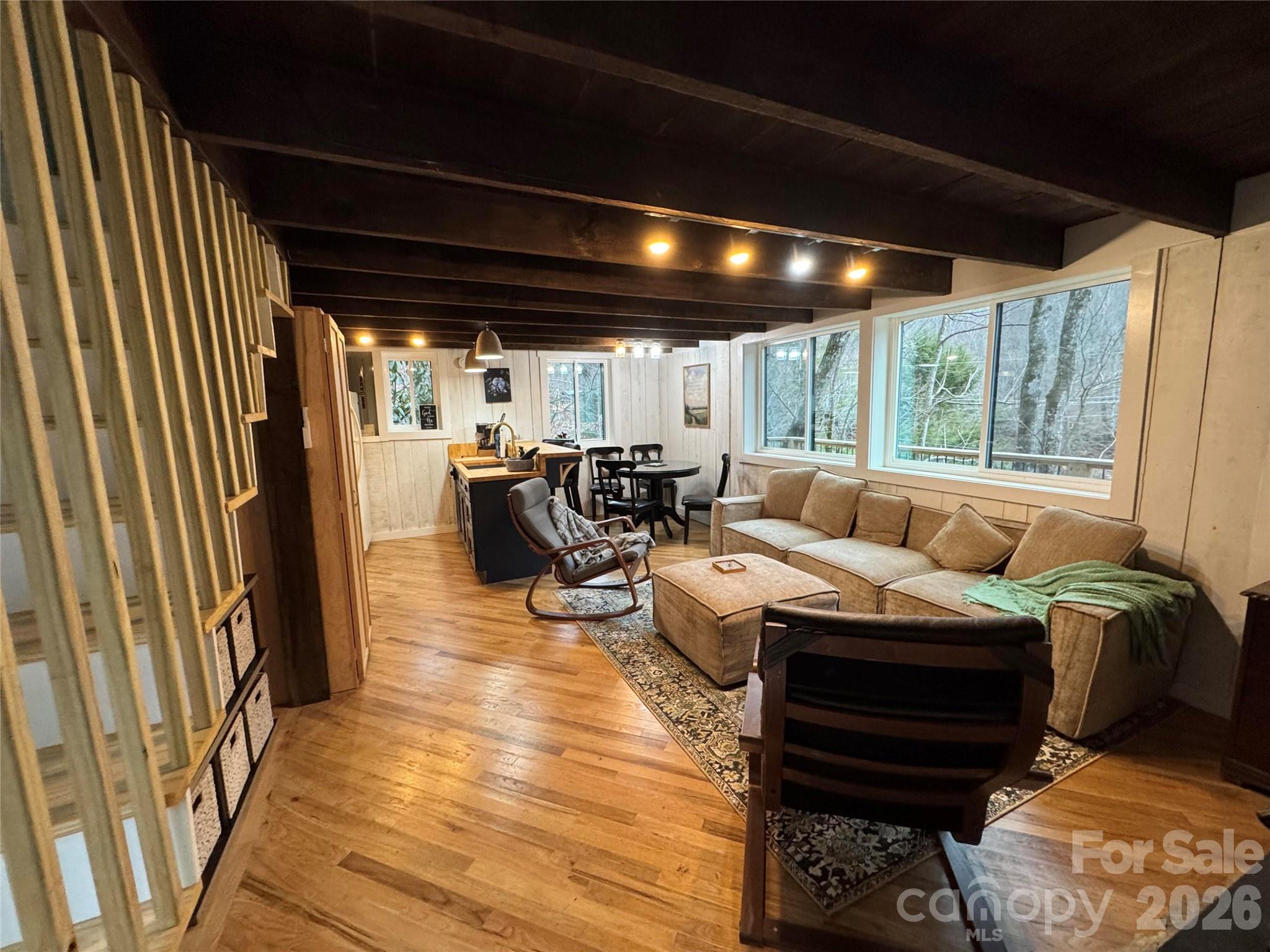 101 Mountain Farm Road Burnsville, NC 28714 - Photo 16 of 32 a living room with furniture and a large window