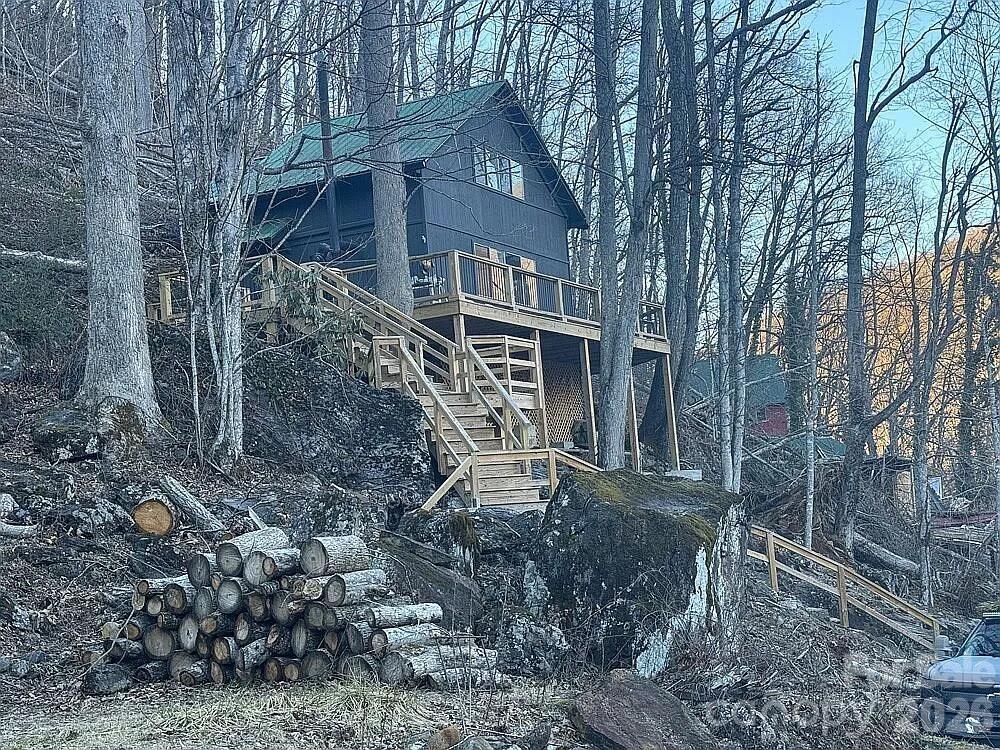 101 Mountain Farm Road Burnsville, NC 28714 - Photo 2 of 32 a view of a house with a yard