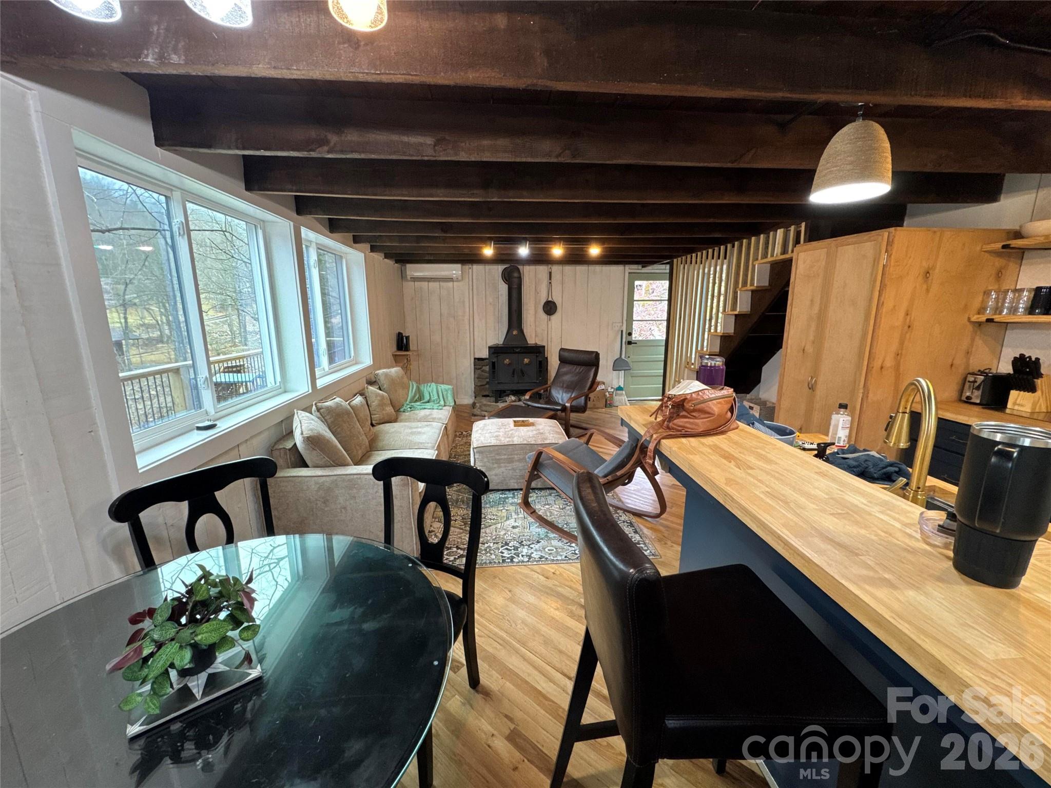 101 Mountain Farm Road Burnsville, NC 28714 - Photo 21 of 32 a dining room with furniture and a large window
