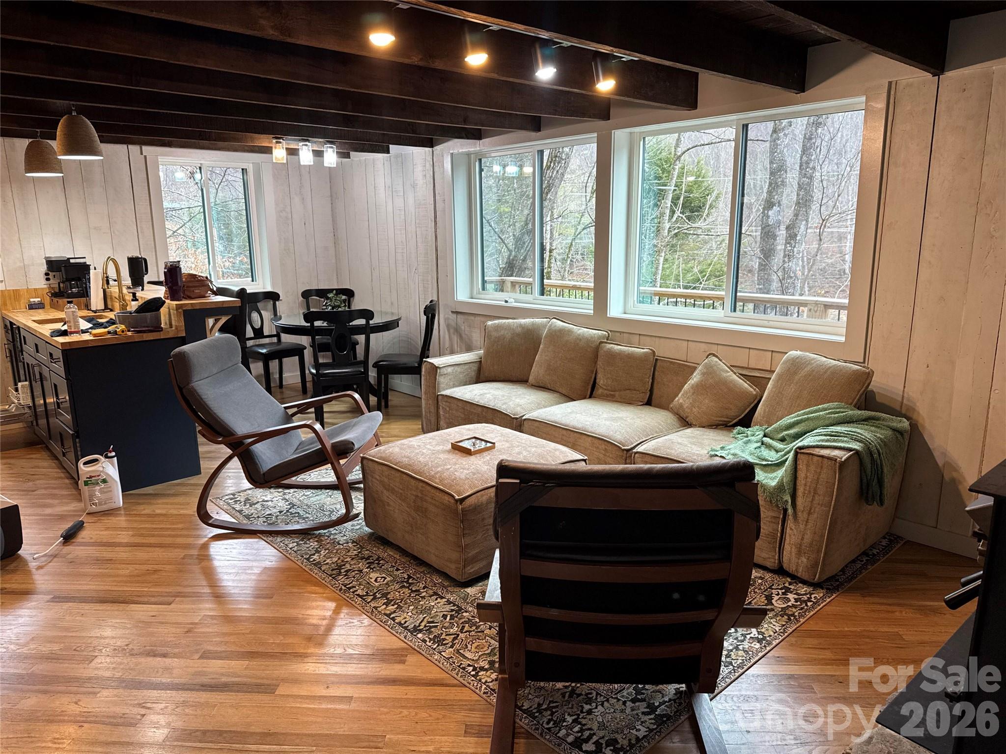 101 Mountain Farm Road Burnsville, NC 28714 - Photo 22 of 32 a living room with furniture and a large window