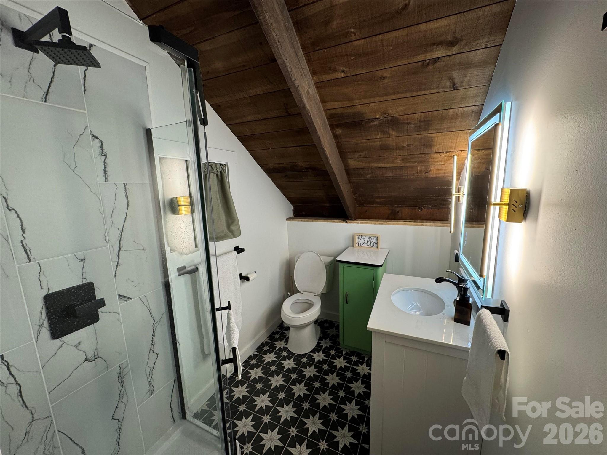 101 Mountain Farm Road Burnsville, NC 28714 - Photo 23 of 32 a bathroom with a toilet and a shower