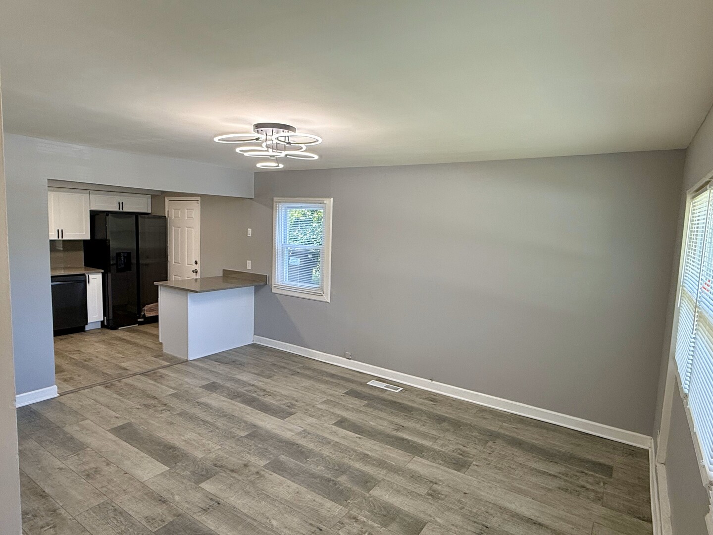 263 Allegheny Street Park Forest, IL 60466 - Photo 2 of 15 wooden floor in an empty room with a kitchen