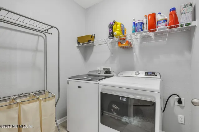 a utility room with dryer and washer