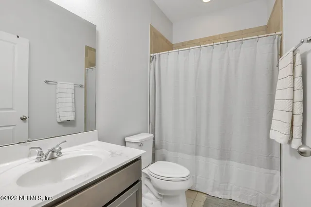 a bathroom with a sink and toilet