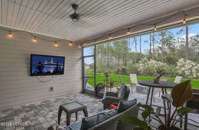 a outdoor living space with furniture and a potted plant