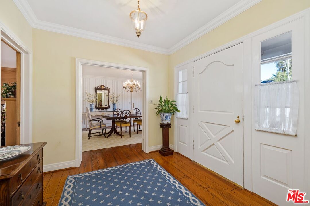 335 Homewood Road Los Angeles, CA 90049 - Photo 8 of 17 a living room with furniture and a table