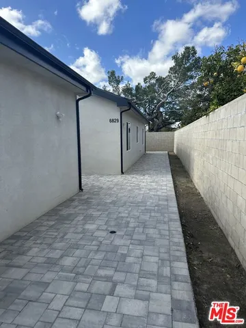 a view of a back yard of the house