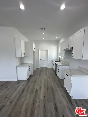 a large kitchen with cabinets