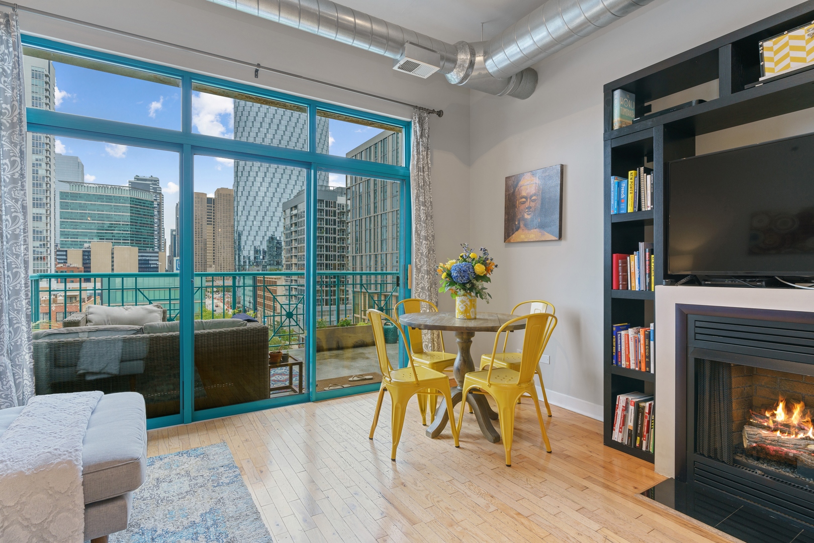 910 West Madison Street, Unit 807 Chicago, IL 60607 - Photo 11 of 21 a dining room with furniture and a flat screen tv