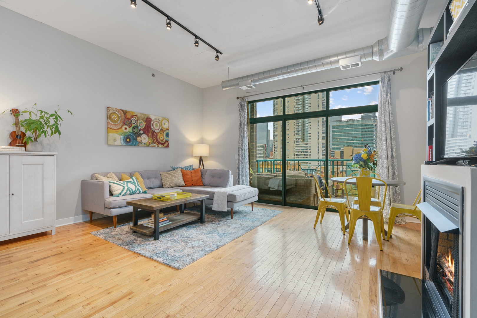 910 West Madison Street, Unit 807 Chicago, IL 60607 - Photo 4 of 21 a living room with furniture large window and a table