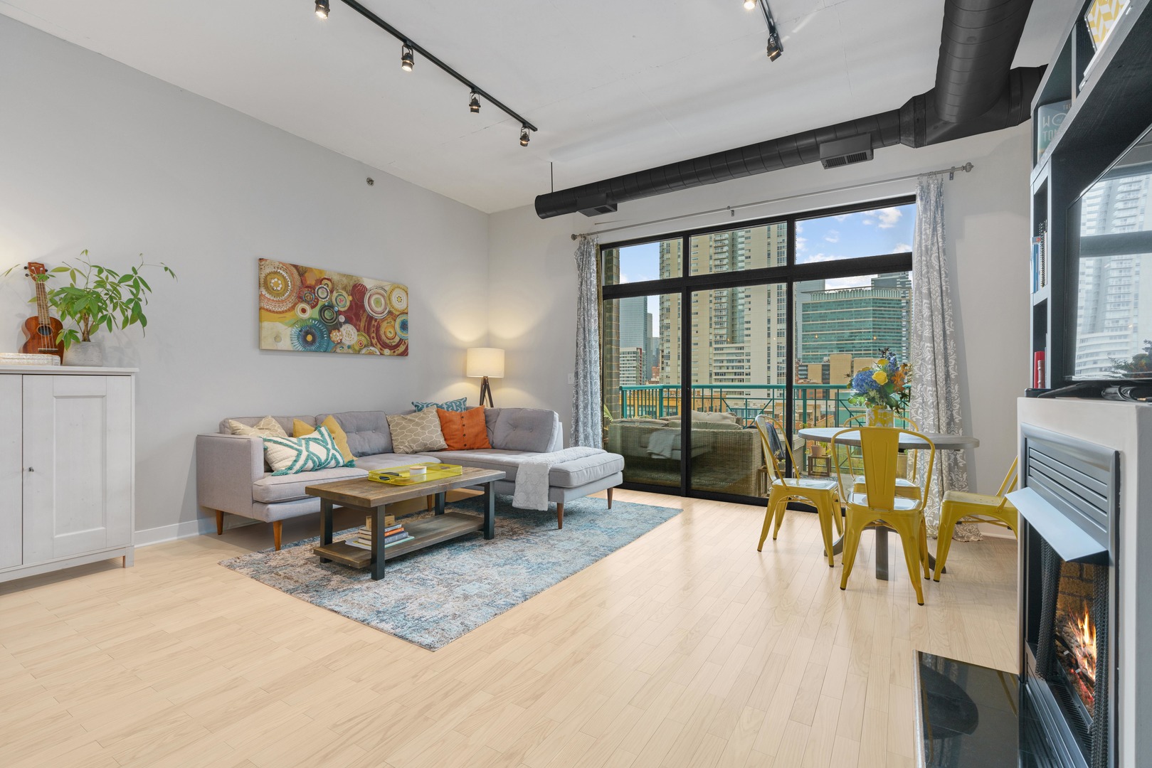 910 West Madison Street, Unit 807 Chicago, IL 60607 - Photo 6 of 21 a living room with furniture large window and a table