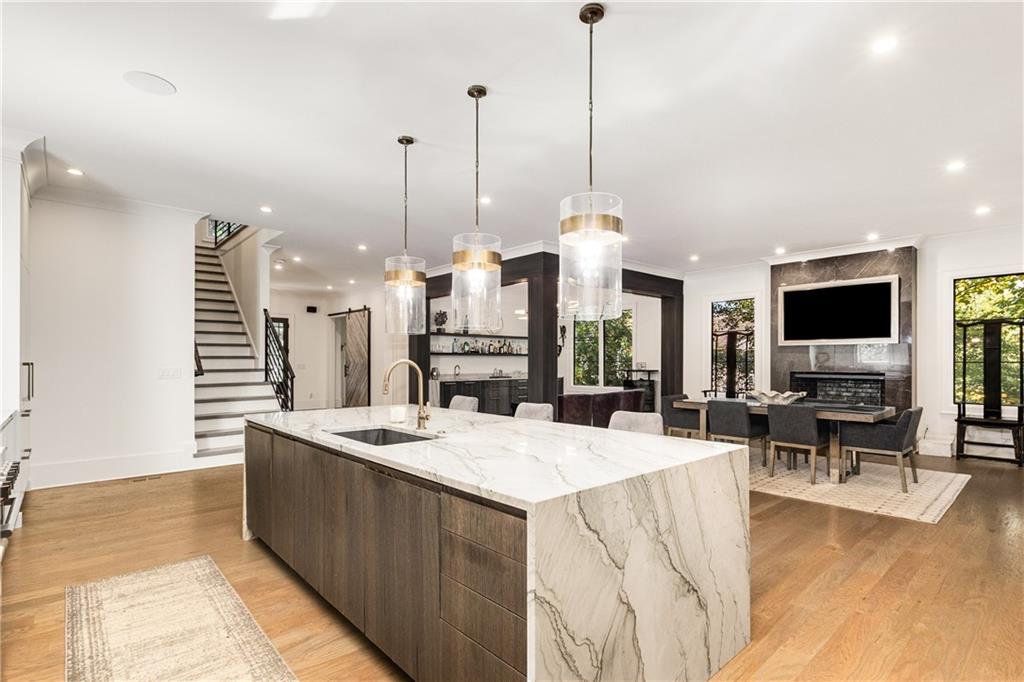 306 Pinecrest Road Northeast Atlanta, GA 30342 - Photo 15 of 67 a living room with furniture a flat screen tv and a large window