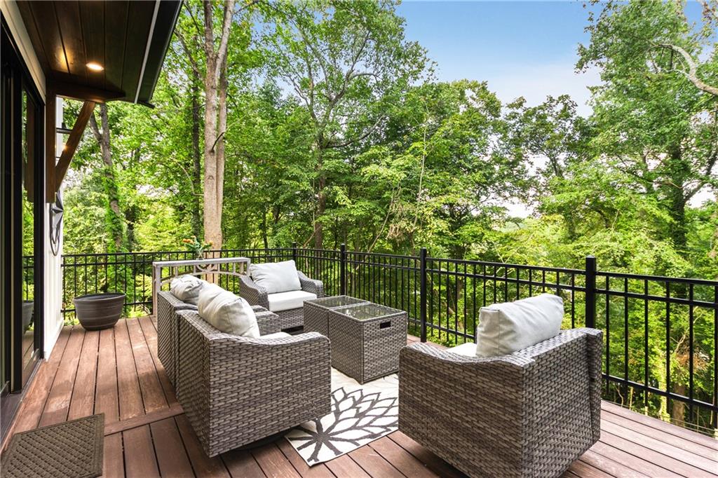 306 Pinecrest Road Northeast Atlanta, GA 30342 - Photo 21 of 67 a view of a deck with couches chairs with wooden floor
