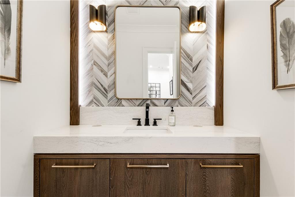 306 Pinecrest Road Northeast Atlanta, GA 30342 - Photo 25 of 67 a bathroom with a sink and a mirror