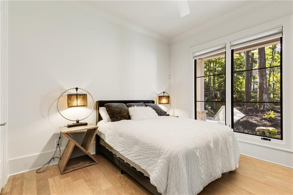 306 Pinecrest Road Northeast Atlanta, GA 30342 - Photo 26 of 67 a bedroom with a bed a table and window