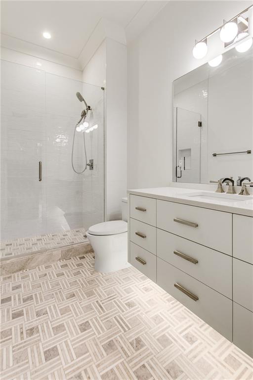 306 Pinecrest Road Northeast Atlanta, GA 30342 - Photo 27 of 67 a bathroom with a sink toilet a mirror and shower