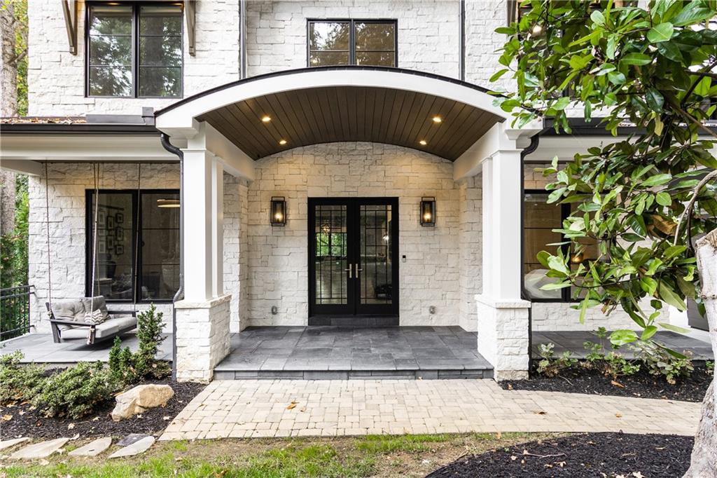 306 Pinecrest Road Northeast Atlanta, GA 30342 - Photo 3 of 67 a front view of a house with a yard