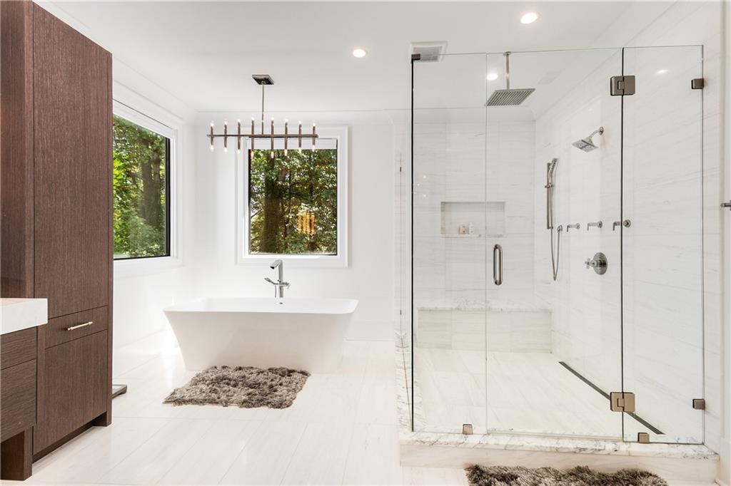 306 Pinecrest Road Northeast Atlanta, GA 30342 - Photo 32 of 67 a bathroom with a bathtub and a sink