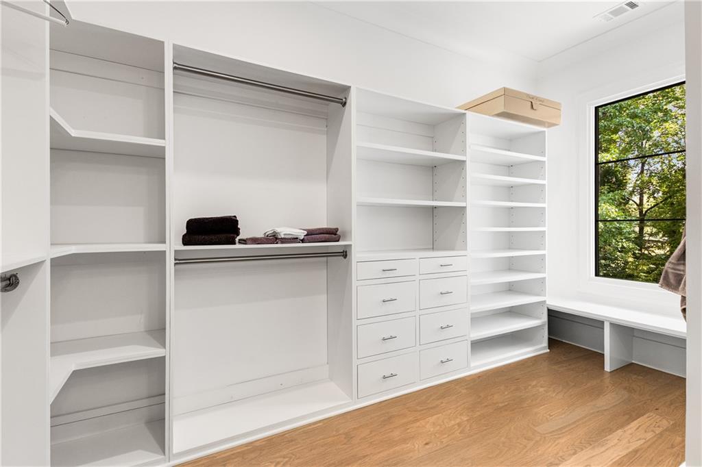 306 Pinecrest Road Northeast Atlanta, GA 30342 - Photo 33 of 67 a view of walk in closet with empty racks