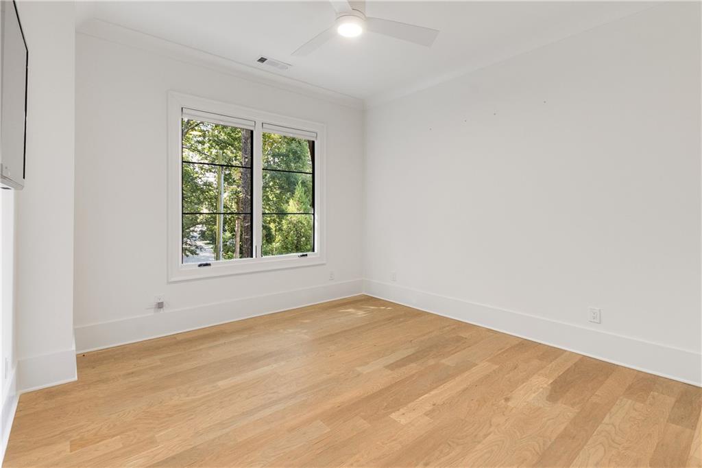306 Pinecrest Road Northeast Atlanta, GA 30342 - Photo 36 of 67 an empty room with a window