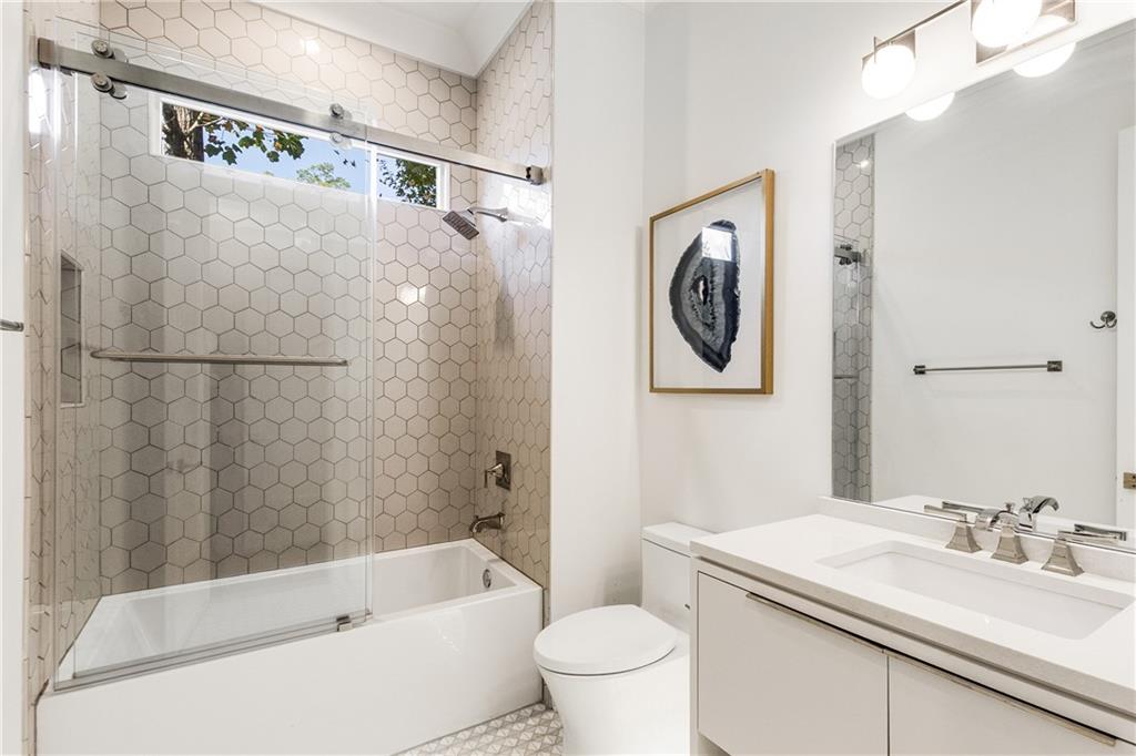 306 Pinecrest Road Northeast Atlanta, GA 30342 - Photo 37 of 67 a bathroom with a sink a toilet and a bathtub