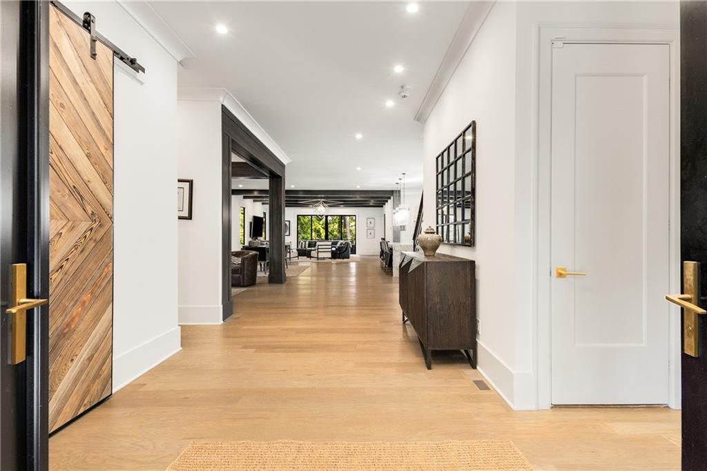 306 Pinecrest Road Northeast Atlanta, GA 30342 - Photo 4 of 67 a view of a hallway with wooden floor and furniture