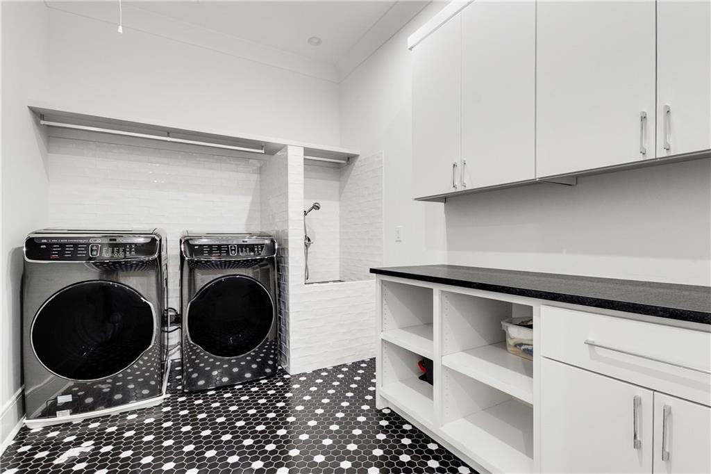 306 Pinecrest Road Northeast Atlanta, GA 30342 - Photo 44 of 67 a room with a washing machine and washing machine