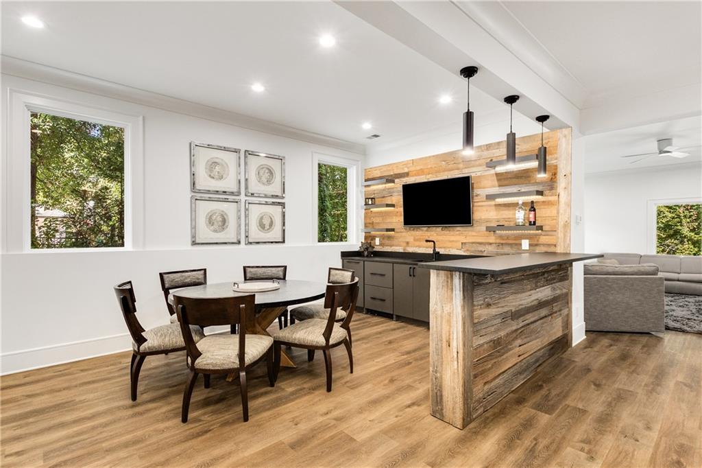 306 Pinecrest Road Northeast Atlanta, GA 30342 - Photo 47 of 67 a view of a workspace with furniture and a window