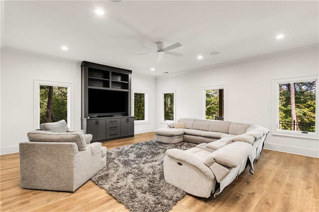 306 Pinecrest Road Northeast Atlanta, GA 30342 - Photo 49 of 67 a living room with furniture and a flat screen tv