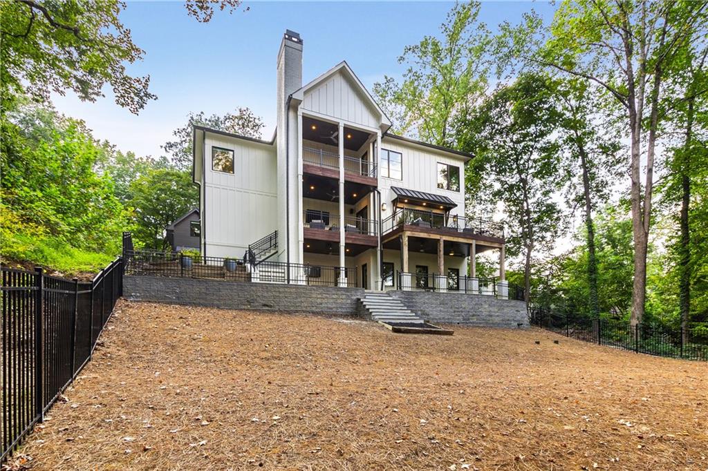 306 Pinecrest Road Northeast Atlanta, GA 30342 - Photo 59 of 67 a front view of a house with a garden