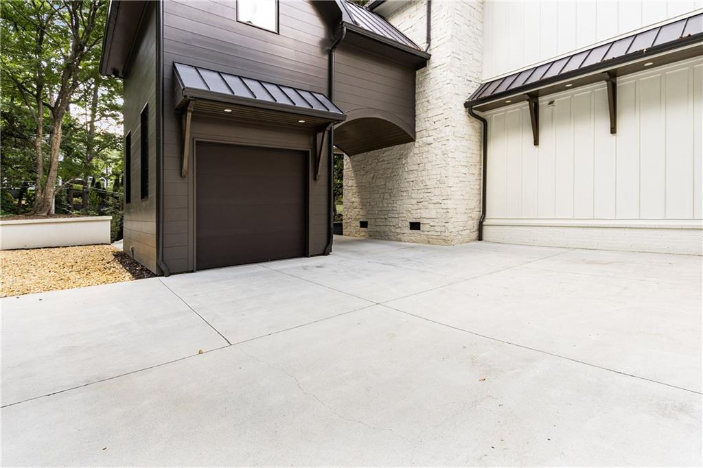 306 Pinecrest Road Northeast Atlanta, GA 30342 - Photo 63 of 67 a view of a house with a garage