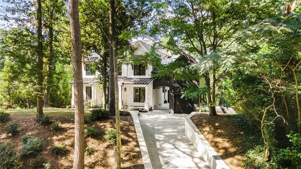 306 Pinecrest Road Northeast Atlanta, GA 30342 - Photo 65 of 67 a view of a patio with table and chairs and potted plants