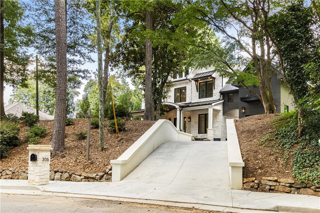 306 Pinecrest Road Northeast Atlanta, GA 30342 - Photo 66 of 67 front view of a house with a yard