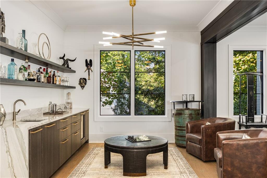 306 Pinecrest Road Northeast Atlanta, GA 30342 - Photo 8 of 67 a kitchen with stainless steel appliances granite countertop a sink a stove and a wooden floors
