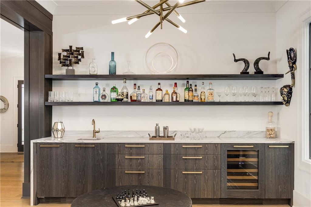 306 Pinecrest Road Northeast Atlanta, GA 30342 - Photo 9 of 67 a kitchen with a cabinets and wooden floor