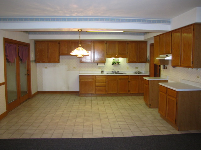 170 Montgomery Road Montgomery, IL 60538 - Photo 11 of 25 a view of a kitchen with a sink and cabinets