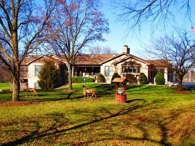 170 Montgomery Road Montgomery, IL 60538 - Photo 2 of 25 a childrens park with lots of trees and plants