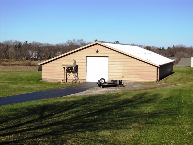 170 Montgomery Road Montgomery, IL 60538 - Photo 22 of 25 a view of a house with a yard