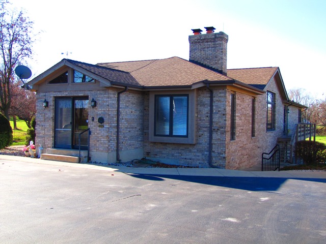 170 Montgomery Road Montgomery, IL 60538 - Photo 23 of 25 a front view of a house with a yard