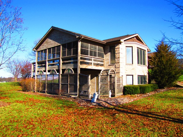 170 Montgomery Road Montgomery, IL 60538 - Photo 24 of 25 a front view of a house with a yard